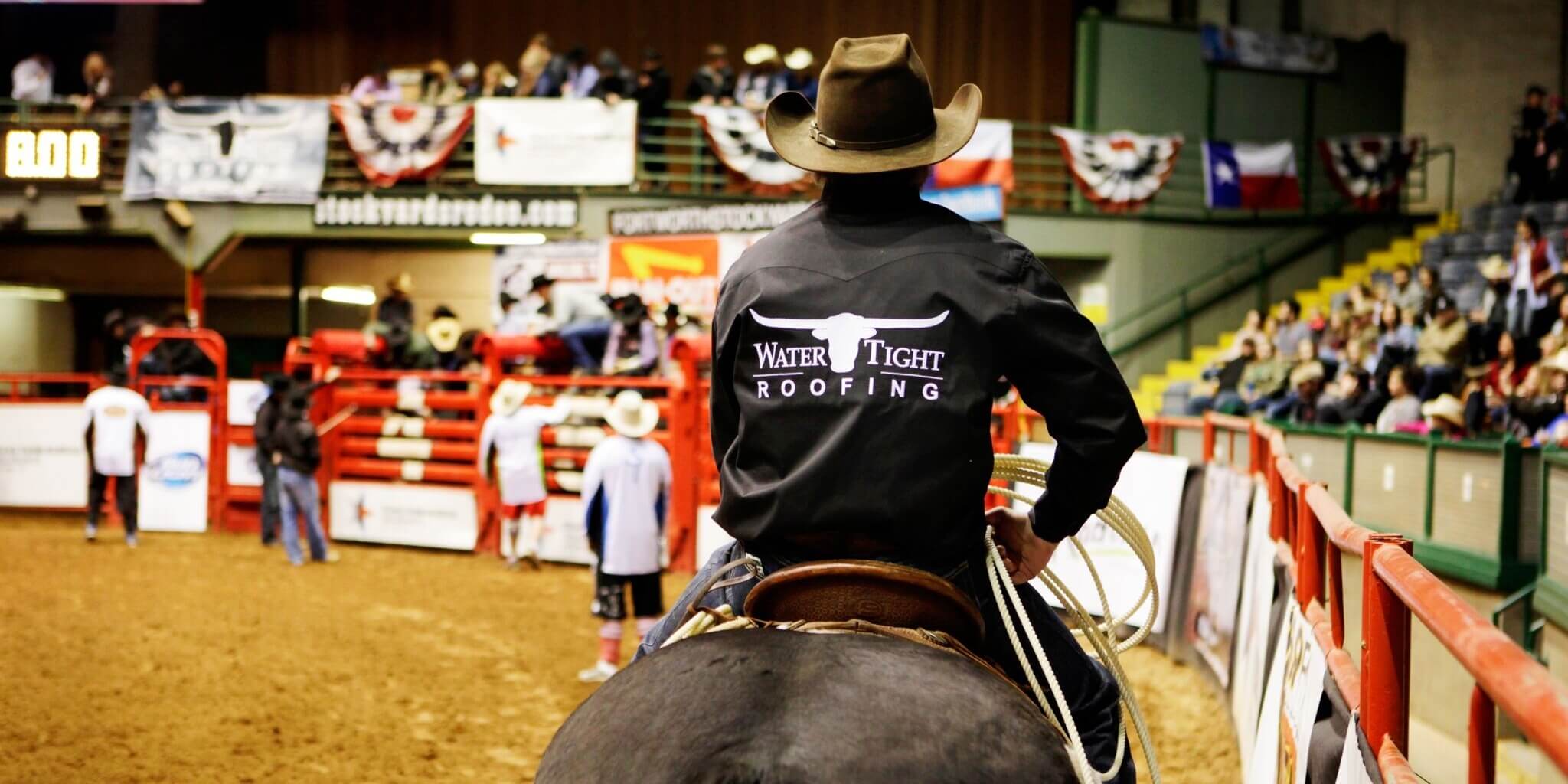 Man on a horse with watertight roofing logo on shirt