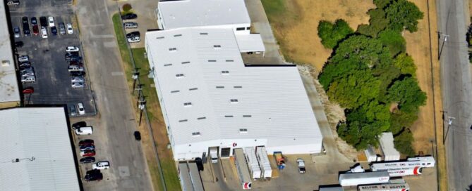 building with white TPO Roofs in Dallas Texas