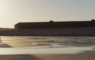 A commercial rooftop with HVAC and solar equipment, showing how proper planning avoids roof damage—contact WaterTight Roofing for a professional site review.