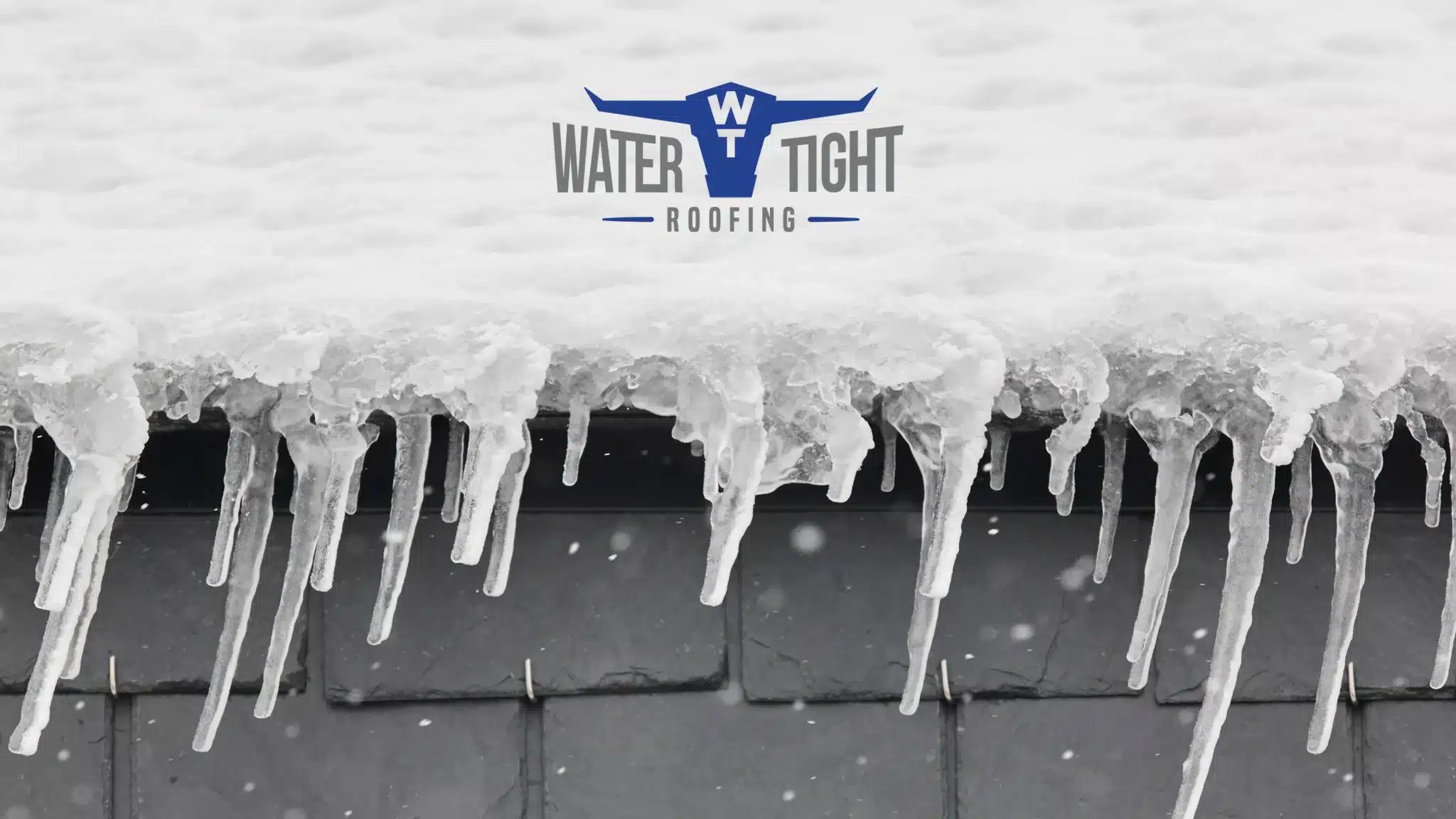 how winter weather quietly damages commercial roofs and what to look for before spring Frozen gutter with water dripping, showing Winter Weather Damage on Commercial Roofs and the need for a post-winter inspection before spring.