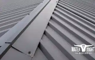 Metal roof leaking storm damage inspection by WaterTight Roofing