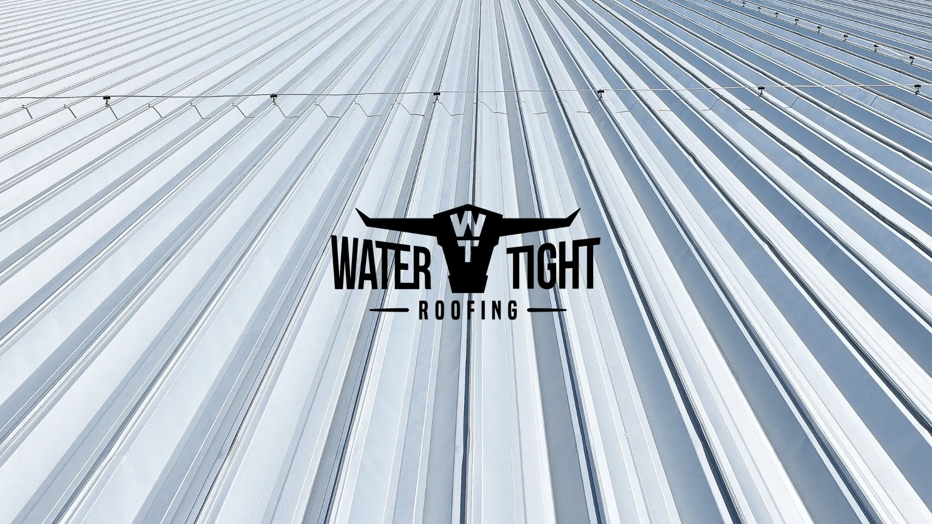 Standing seam metal roofing with WaterTight Roofing logo