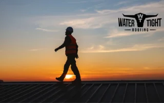 Commercial roofer inspecting summer HVAC foot traffic roof damage